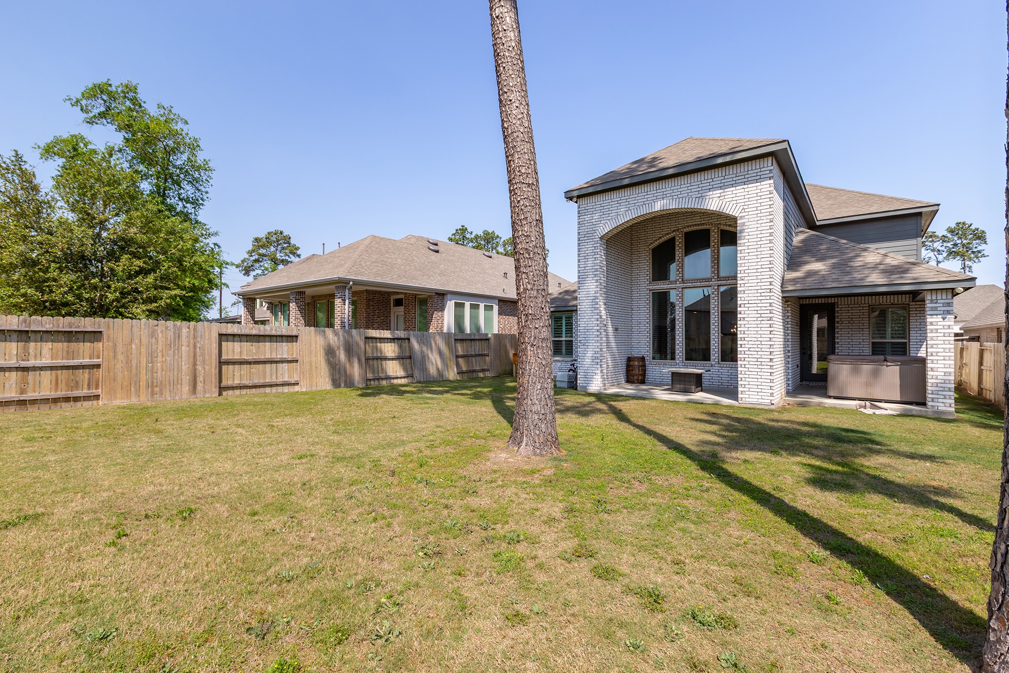 12110 Woodnote Lane Humble, TX 77346 - Photo 30 of 36 a view of a house with a swimming pool
