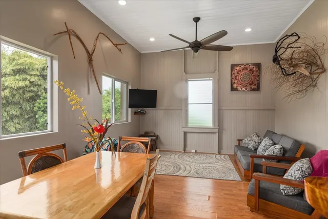 a dining room with furniture and window