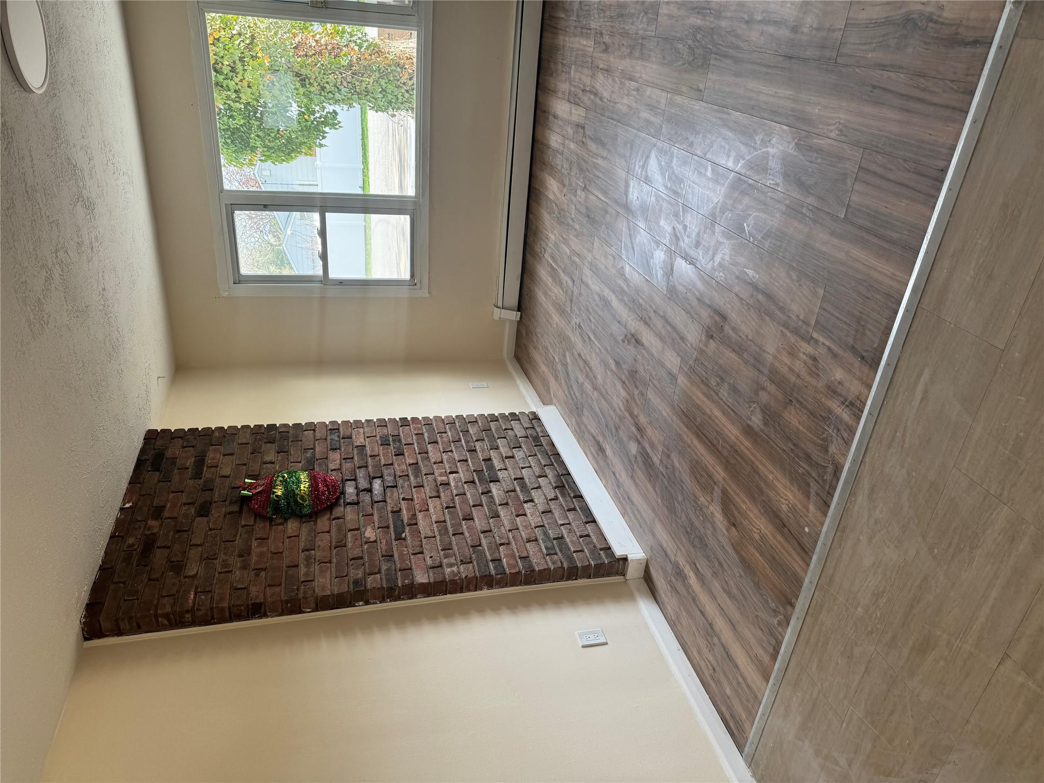 1 Pine Road Middle Island, NY 11953 - Photo 13 of 21 Unfurnished room with a textured ceiling, baseboards, wood finished floors, and a baseboard radiator