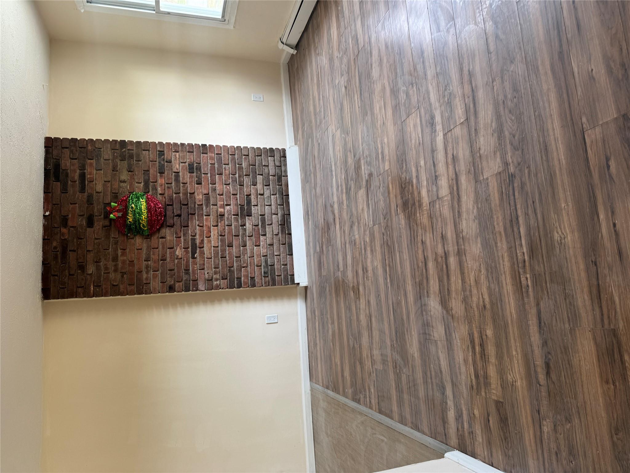 1 Pine Road Middle Island, NY 11953 - Photo 14 of 21 Spare room featuring dark wood-style flooring, baseboards, and a baseboard heating unit