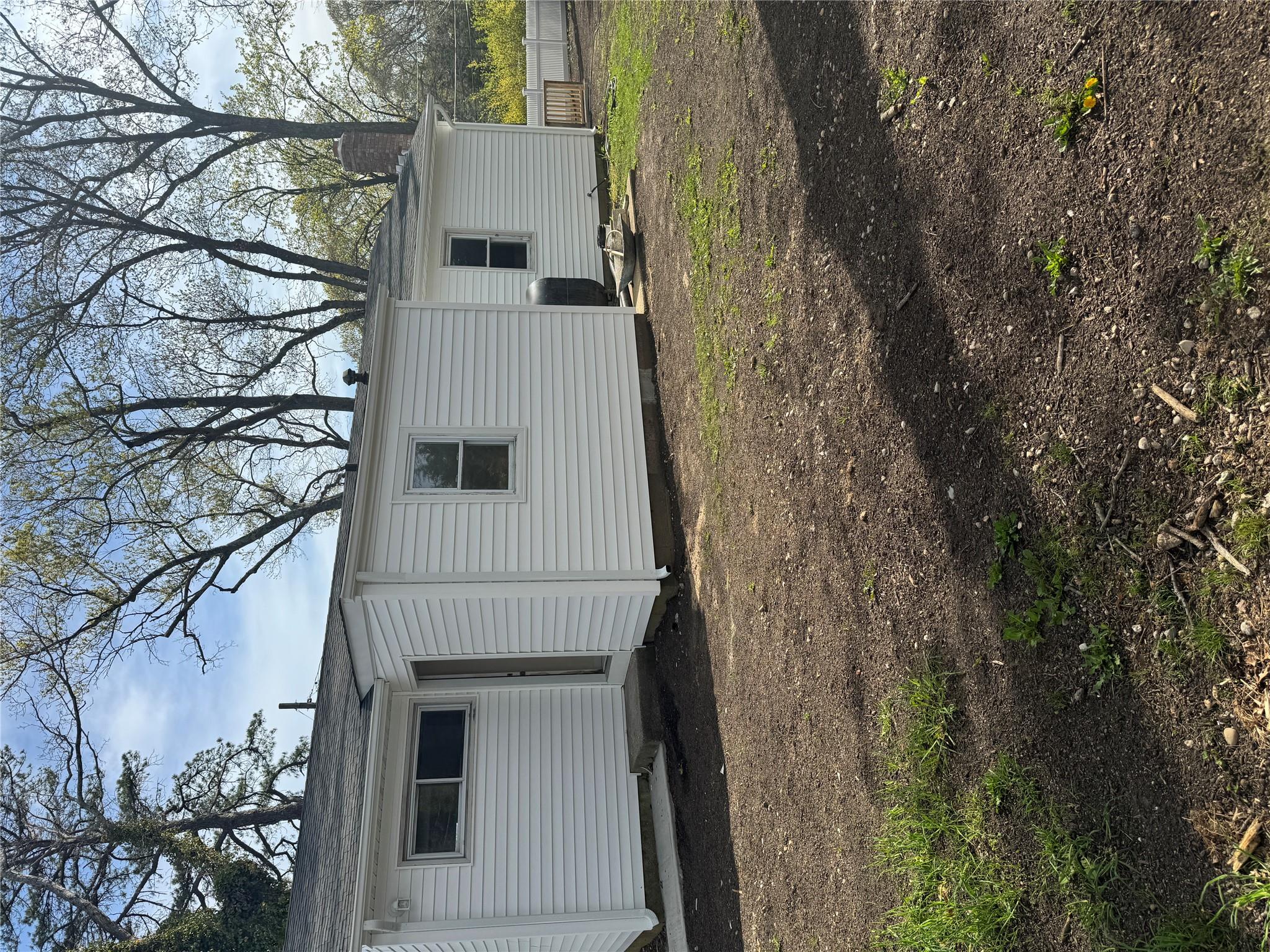 1 Pine Road Middle Island, NY 11953 - Photo 18 of 21 Back of house featuring fence and a chimney