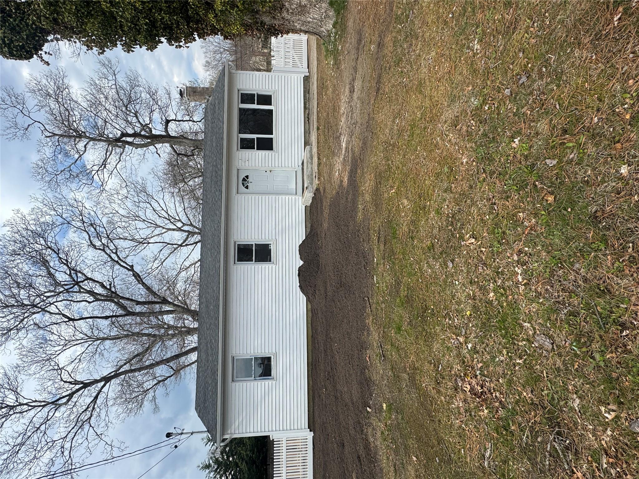1 Pine Road Middle Island, NY 11953 - Photo 2 of 21 View of front of home featuring a chimney and fence