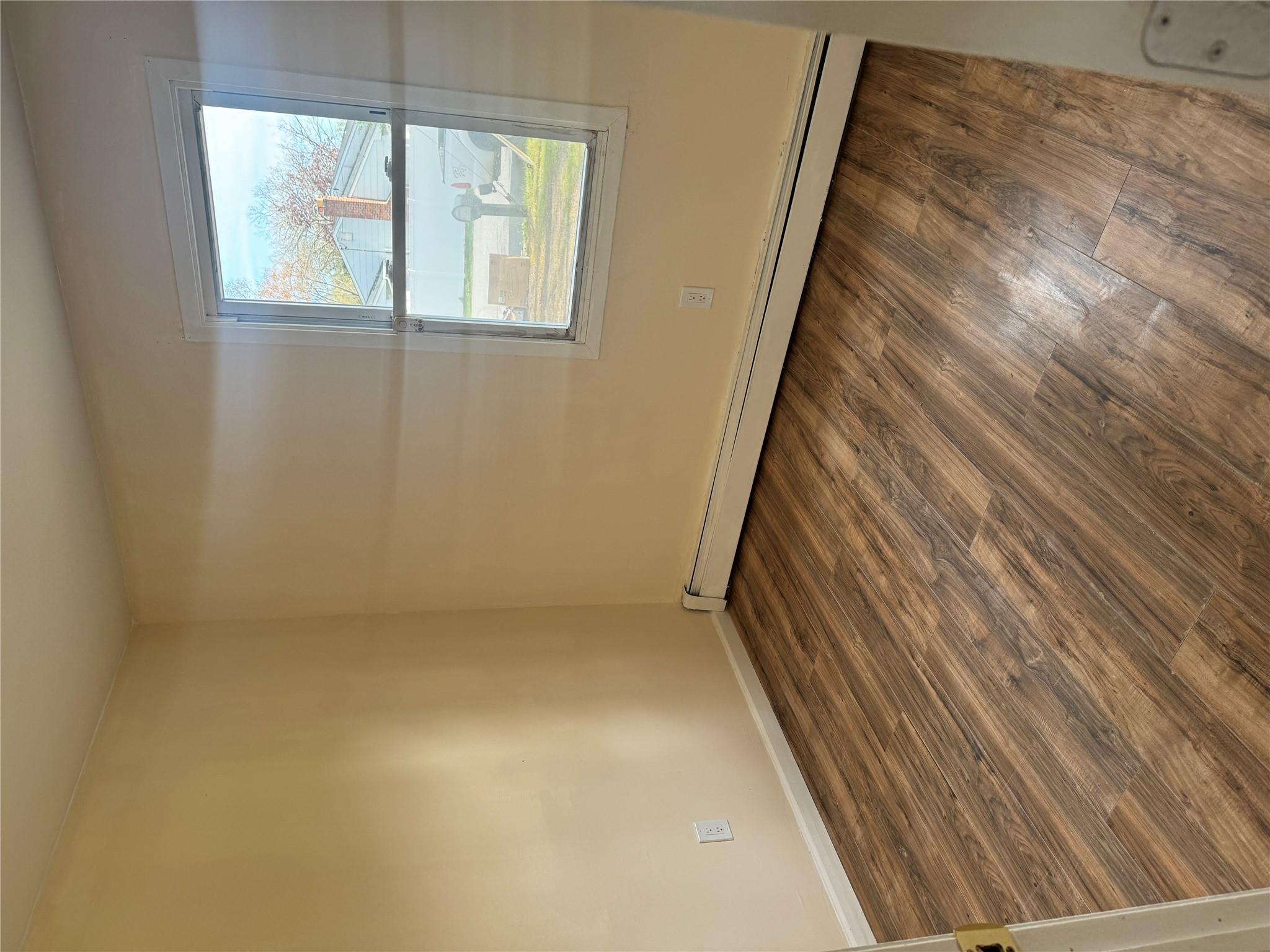1 Pine Road Middle Island, NY 11953 - Photo 7 of 21 Empty room featuring baseboards, a baseboard heating unit, and wood finished floors
