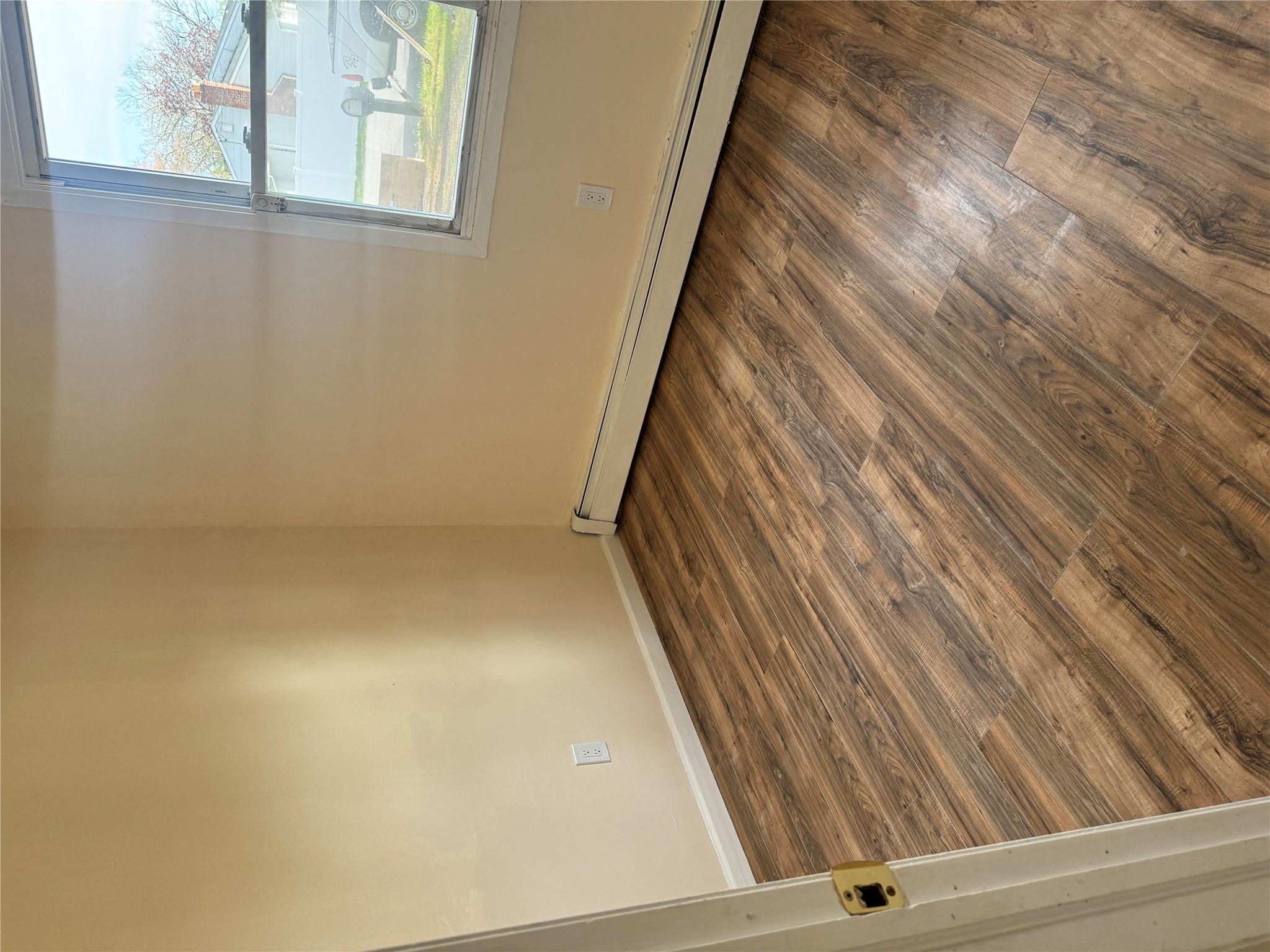 1 Pine Road Middle Island, NY 11953 - Photo 9 of 21 Spare room featuring baseboards, a baseboard heating unit, and wood finished floors