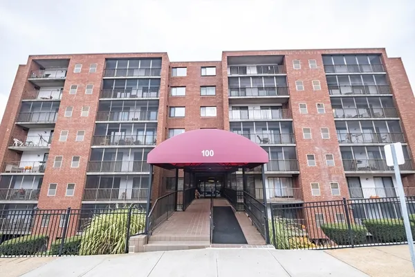 a front view of a building with glass windows
