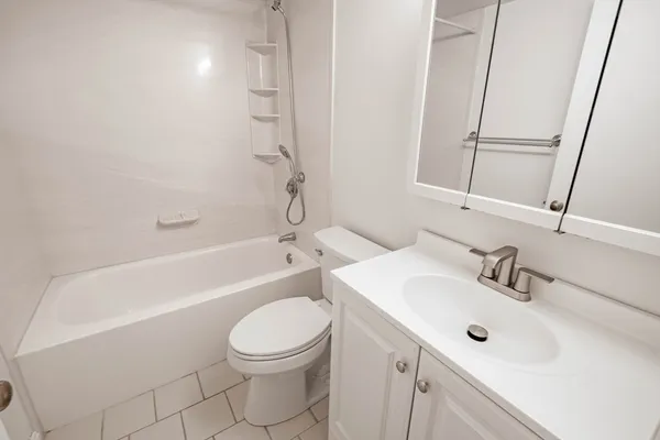 a view of bathroom with a toilet sink and mirror