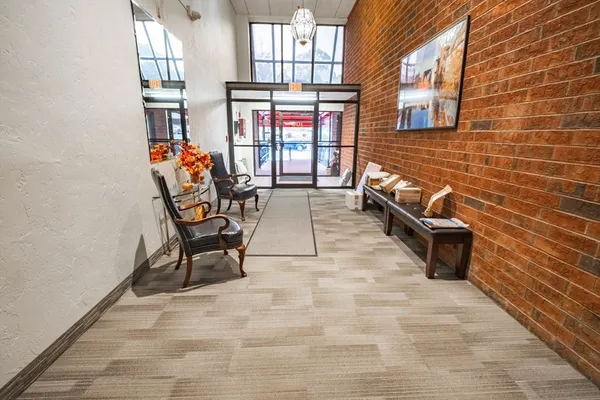 a view of a chairs with table in front of house