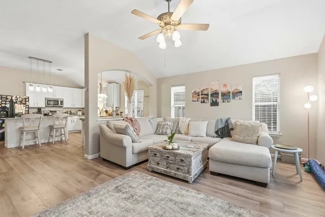 a living room with furniture and a large window