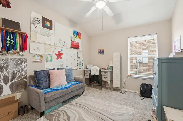 a bathroom with a granite countertop sink a toilet and a mirror