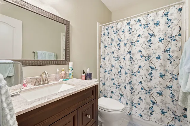 a view of a patio with a table and chairs