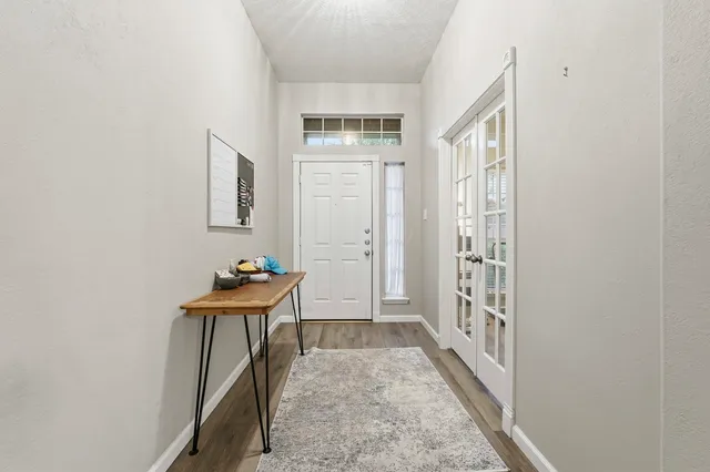 a room that has a window and a table in it