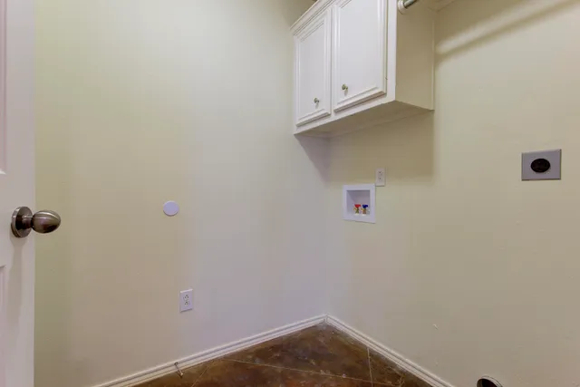 a front view of a house with a garden and porch