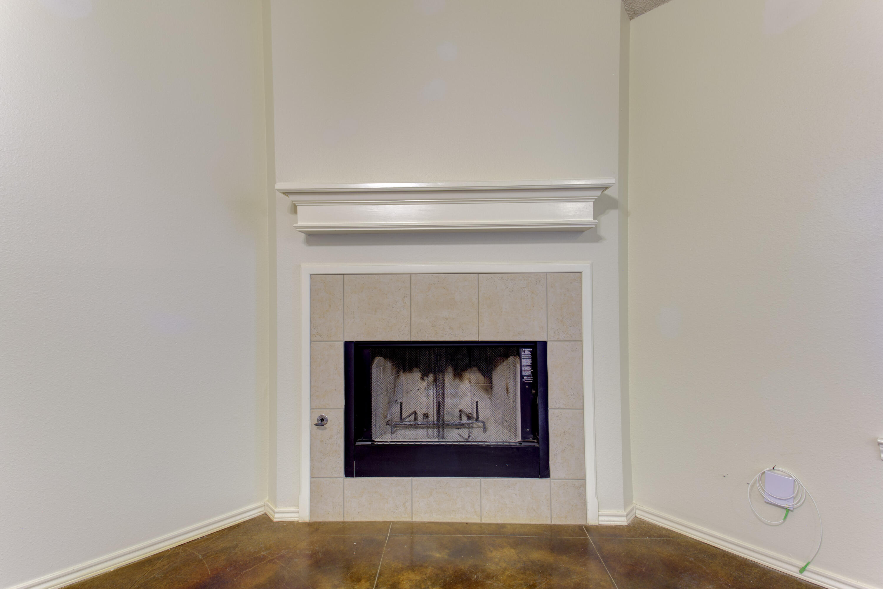 6804 7th Street Lubbock, TX 79416 - Photo 25 of 42 a living room with a fireplace