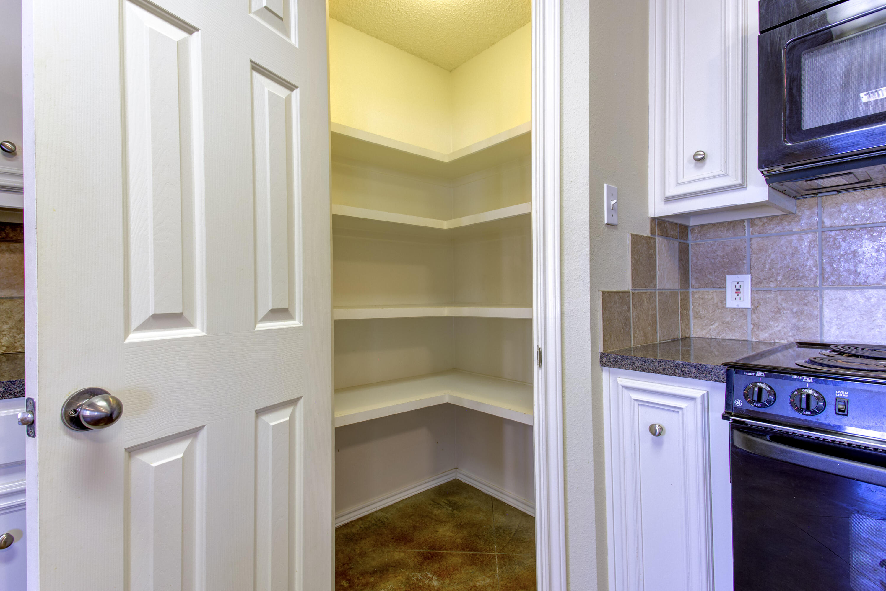 6804 7th Street Lubbock, TX 79416 - Photo 29 of 42 a view of kitchen and utility room