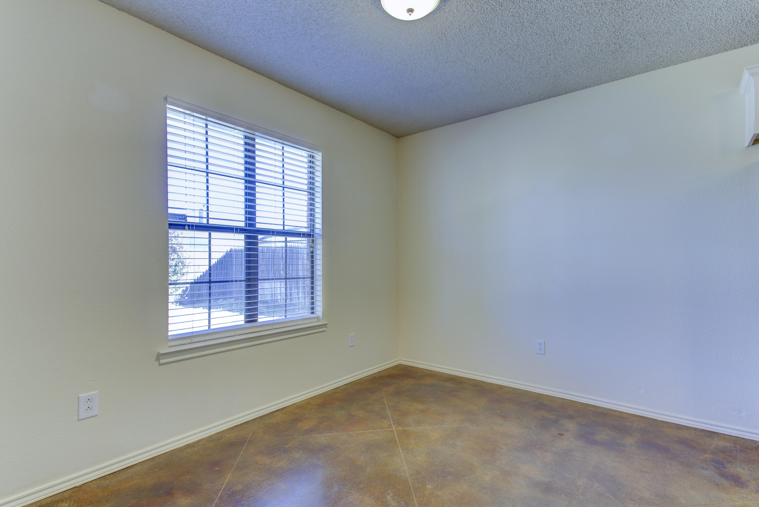 6804 7th Street Lubbock, TX 79416 - Photo 33 of 42 an empty room with a window
