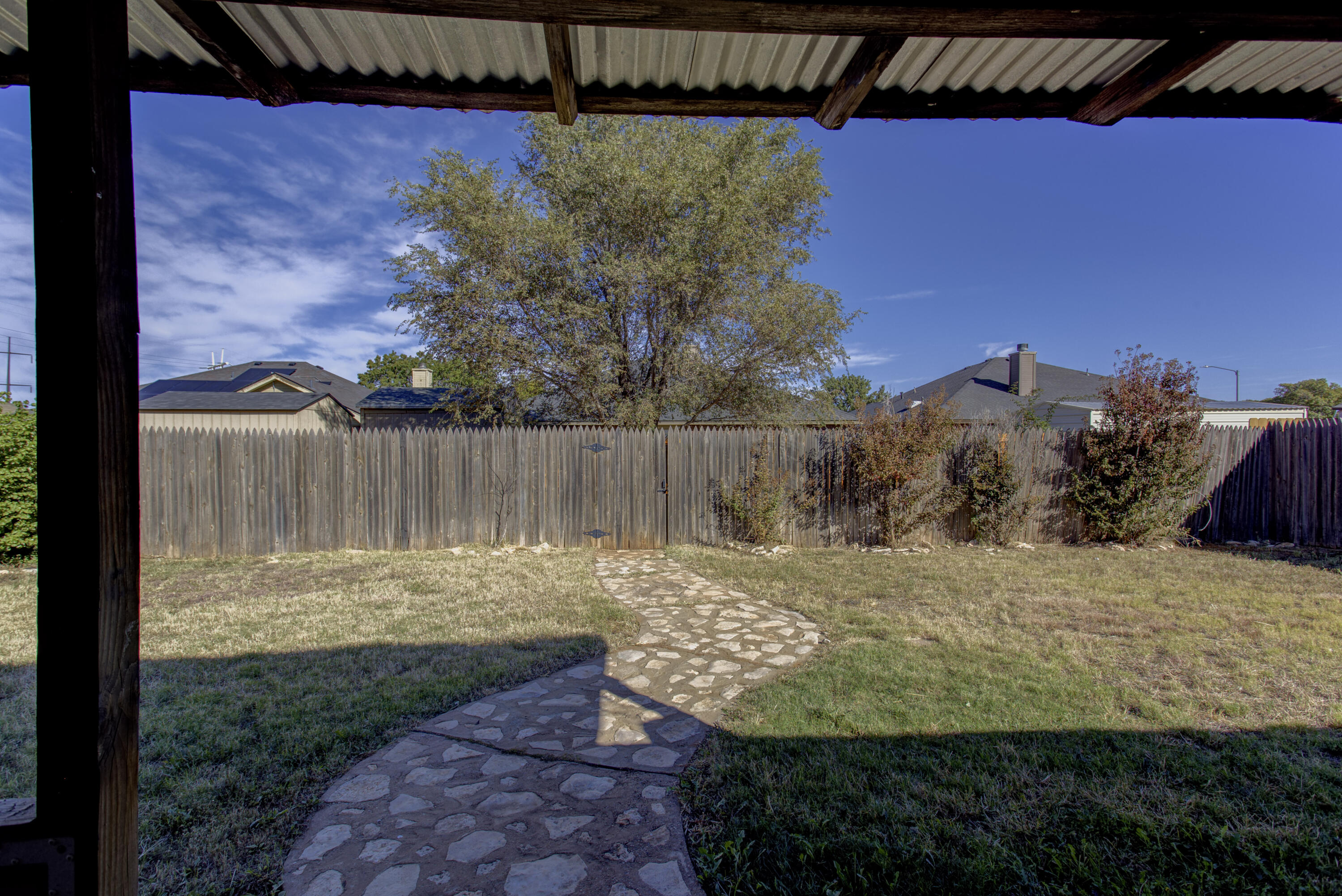 6804 7th Street Lubbock, TX 79416 - Photo 36 of 42 a view of a pathway with a backyard