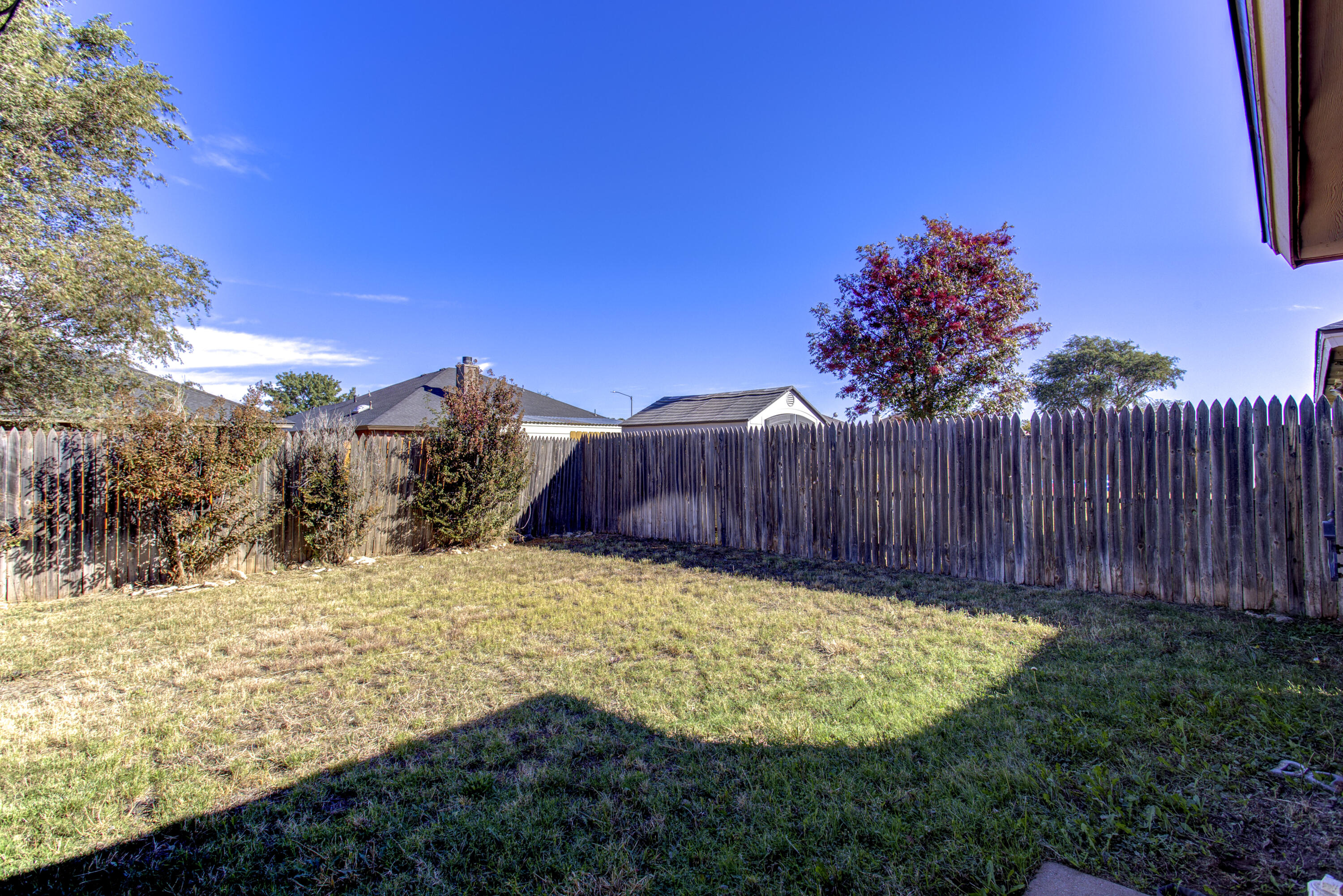 6804 7th Street Lubbock, TX 79416 - Photo 38 of 42 a view of a backyard with wooden fence