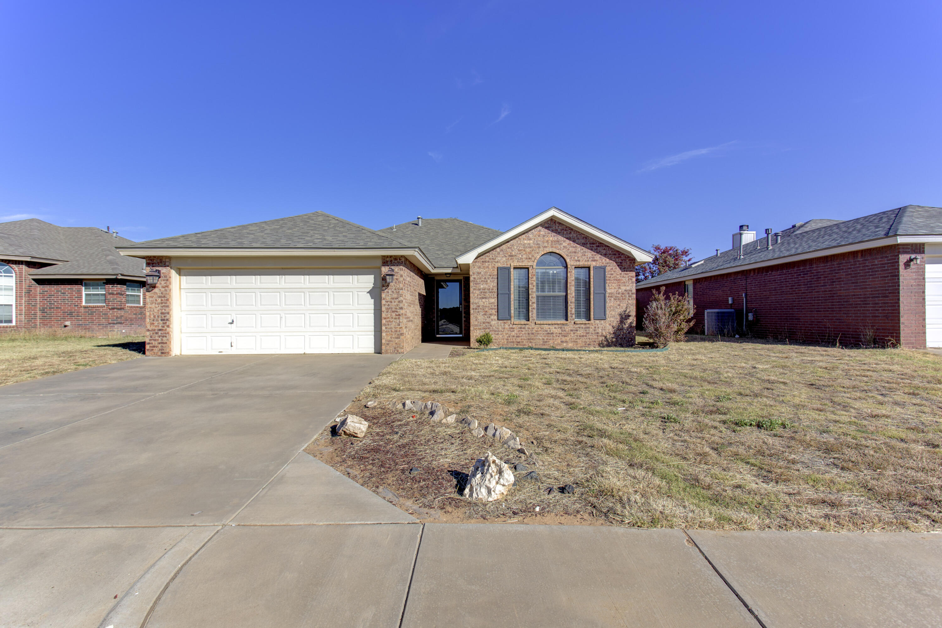 6804 7th Street Lubbock, TX 79416 - Photo 42 of 42 a front view of a house with a yard