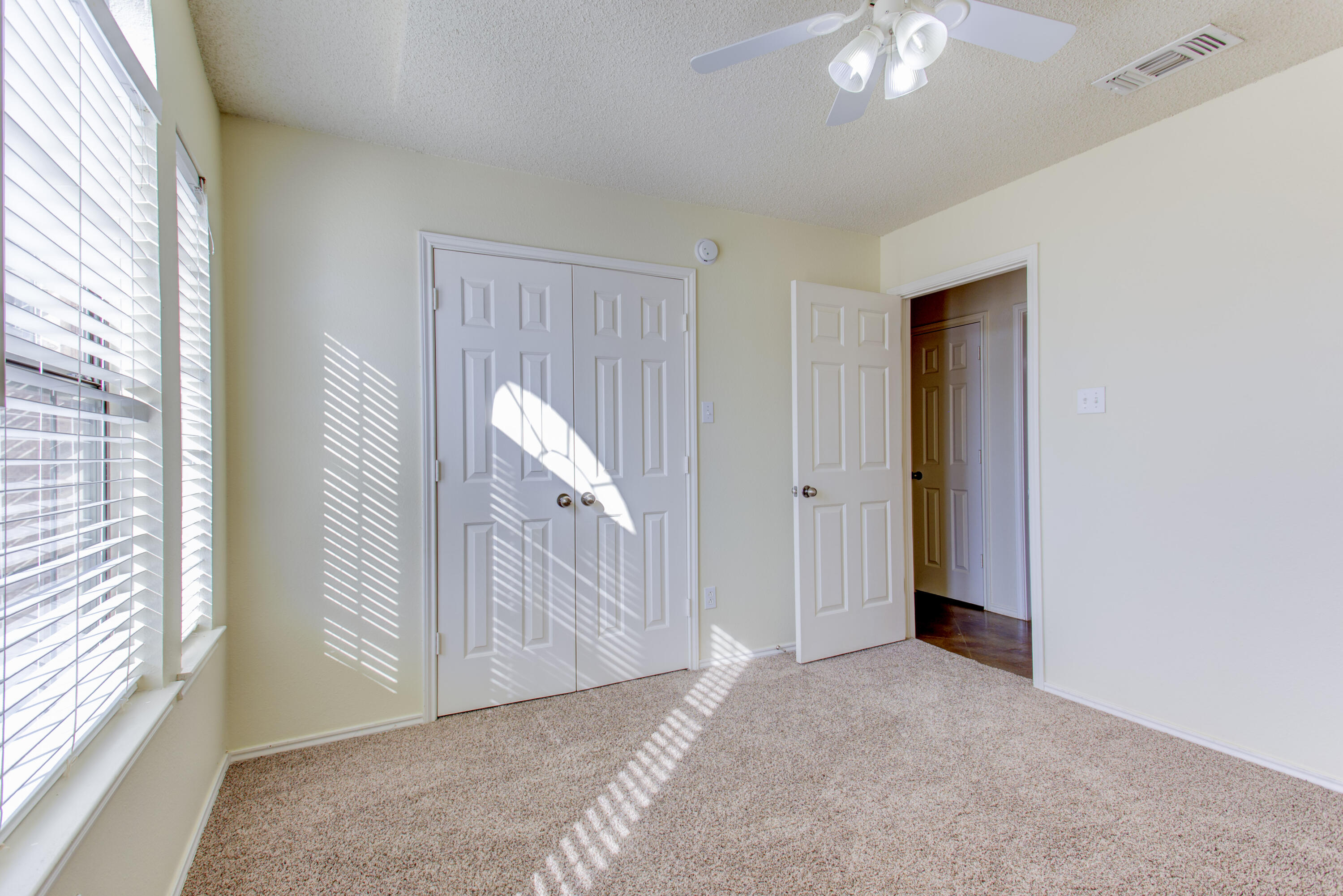 6804 7th Street Lubbock, TX 79416 - Photo 8 of 42 a view of a room with a window and stairs