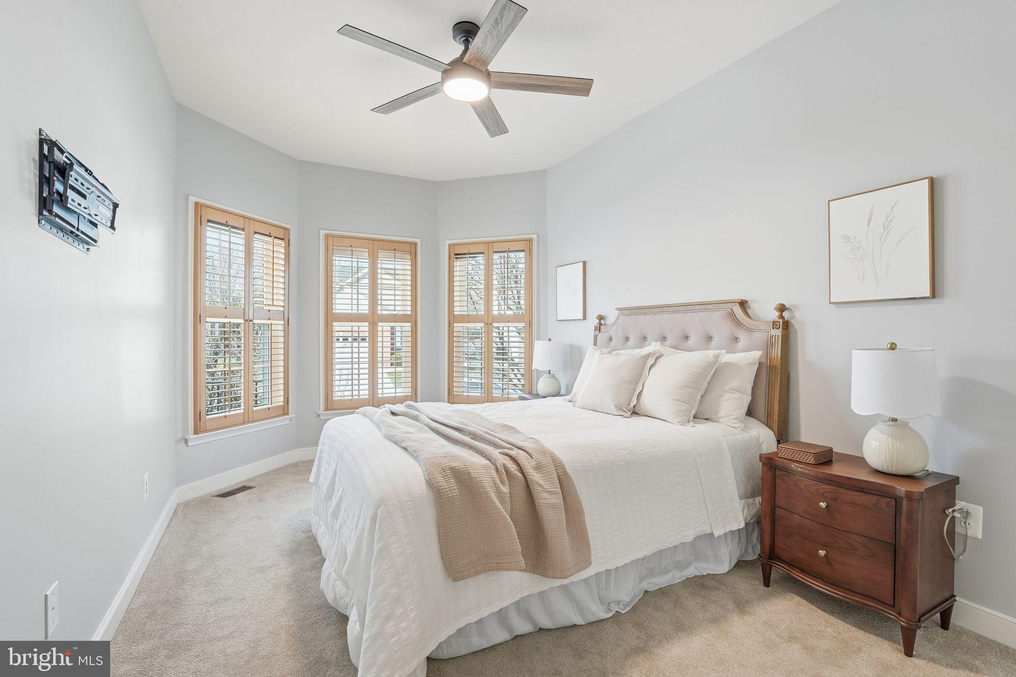 13141 Triple Crown Loop Gainesville, VA 20155 - Photo 13 of 68 a spacious bedroom with a large bed and a window