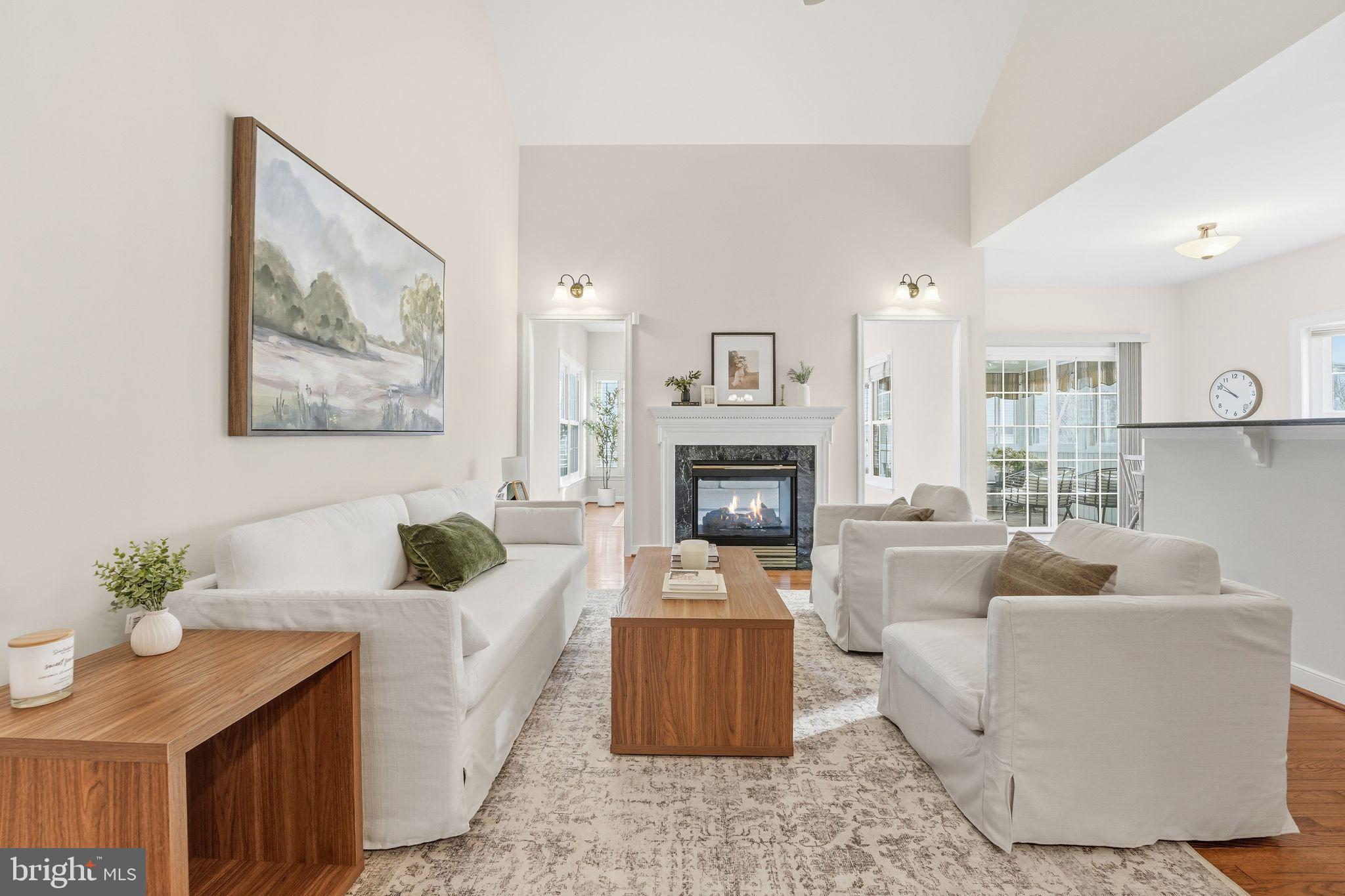 13141 Triple Crown Loop Gainesville, VA 20155 - Photo 18 of 68 a living room with furniture and a fireplace
