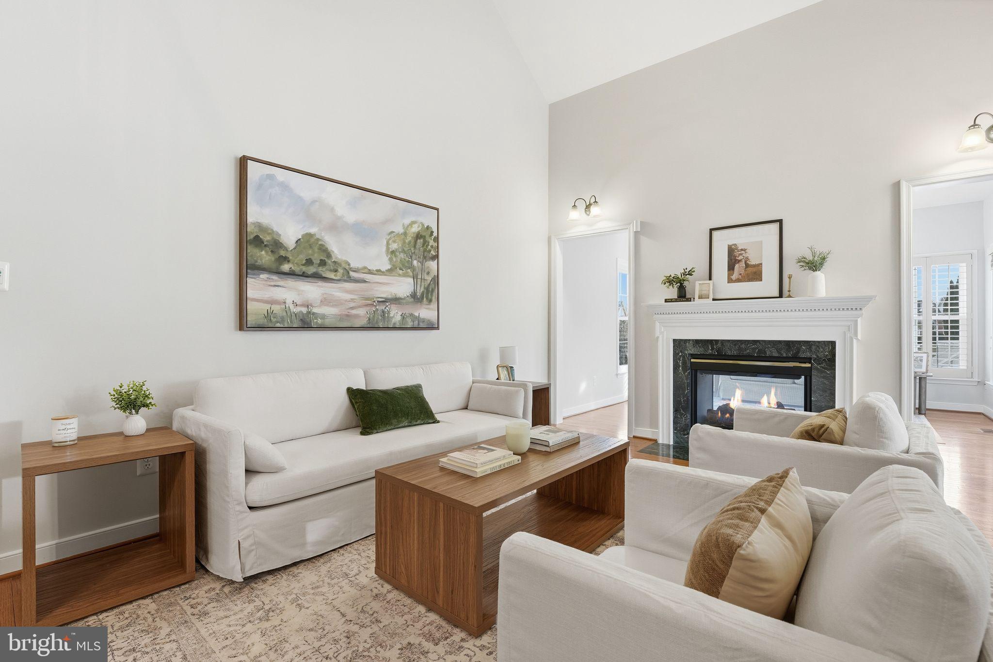 13141 Triple Crown Loop Gainesville, VA 20155 - Photo 19 of 68 a living room with furniture and a fireplace