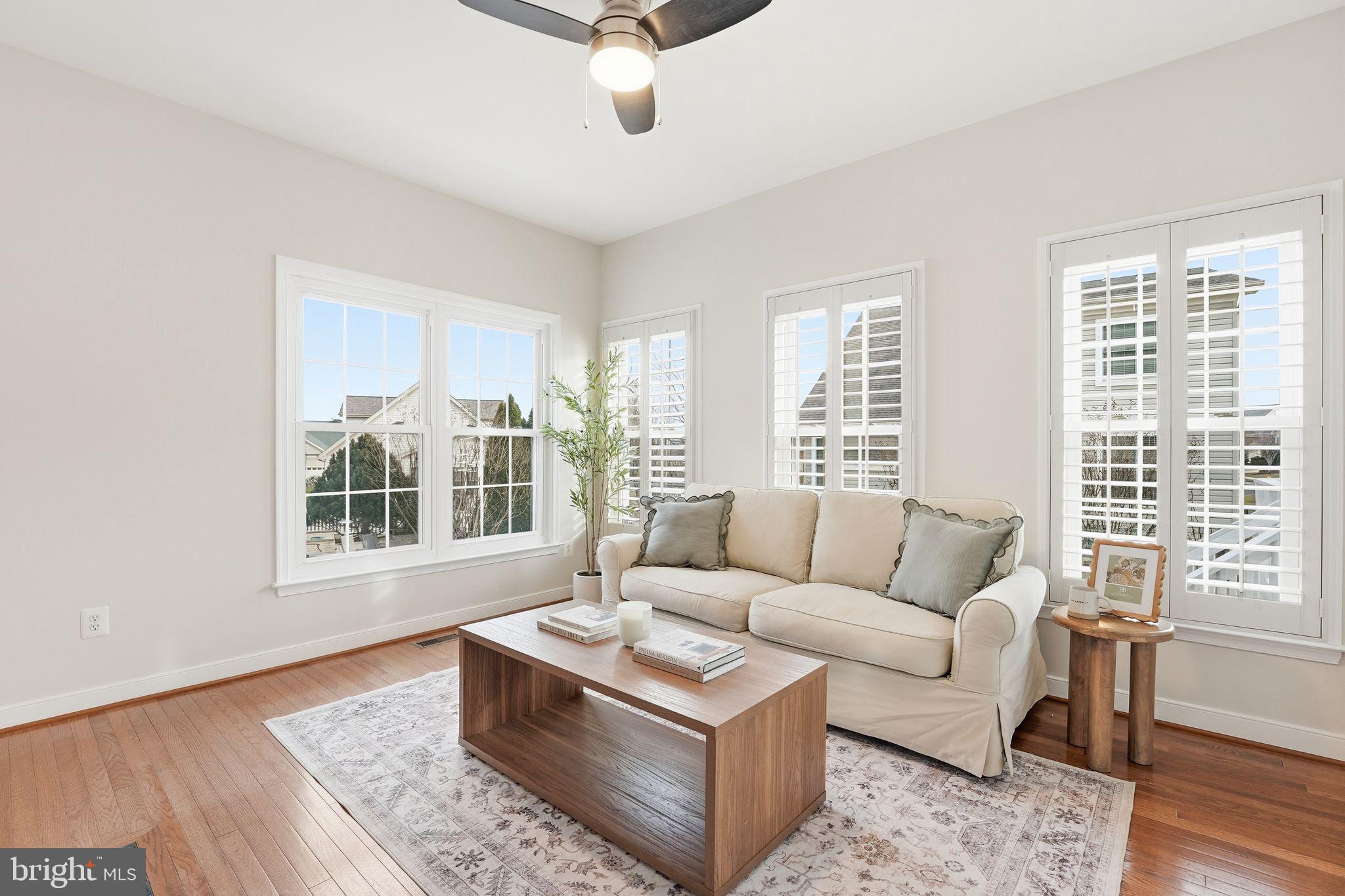 13141 Triple Crown Loop Gainesville, VA 20155 - Photo 22 of 68 a living room with furniture and a large window