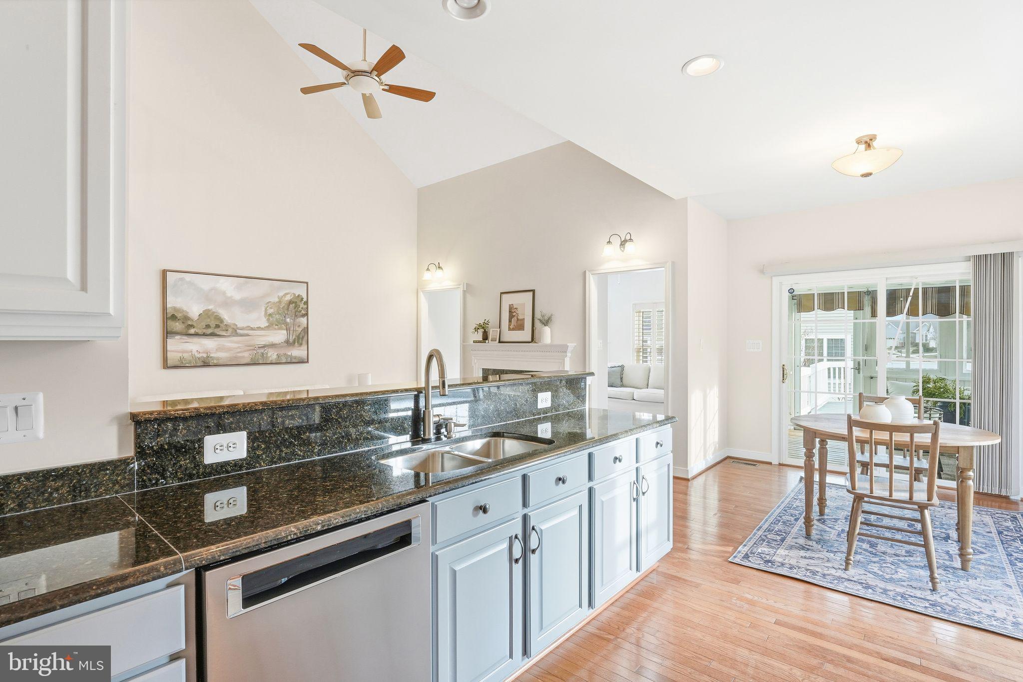 13141 Triple Crown Loop Gainesville, VA 20155 - Photo 28 of 68 a spacious bathroom with a granite countertop sink a large mirror and a window