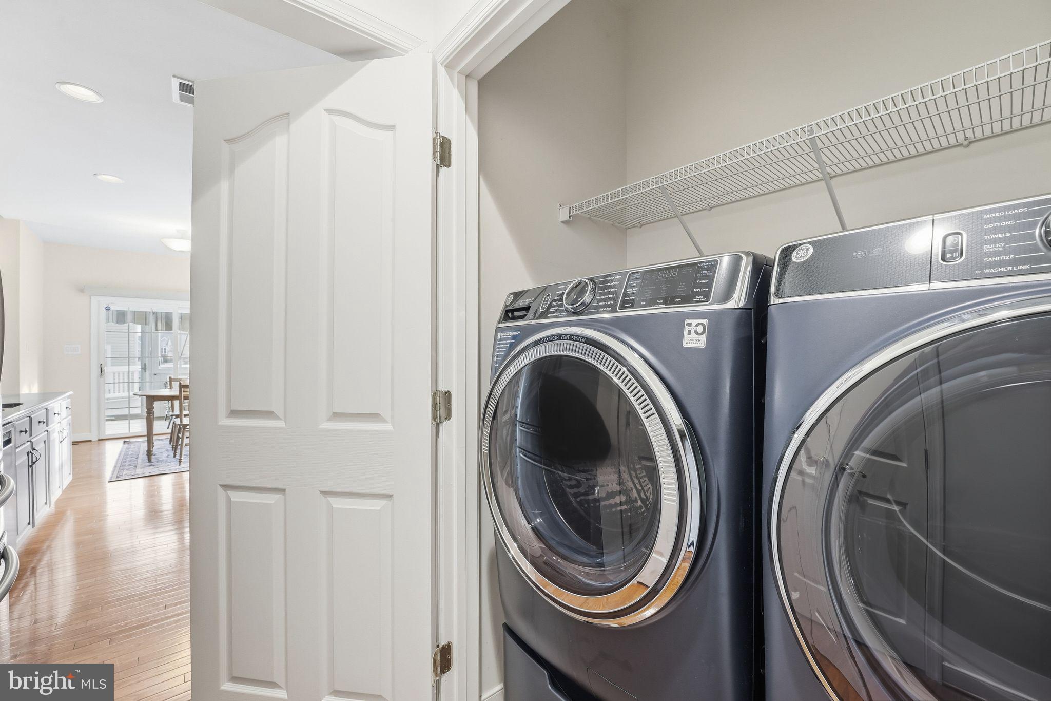 13141 Triple Crown Loop Gainesville, VA 20155 - Photo 30 of 68 a view of a hallway with washer and dryer