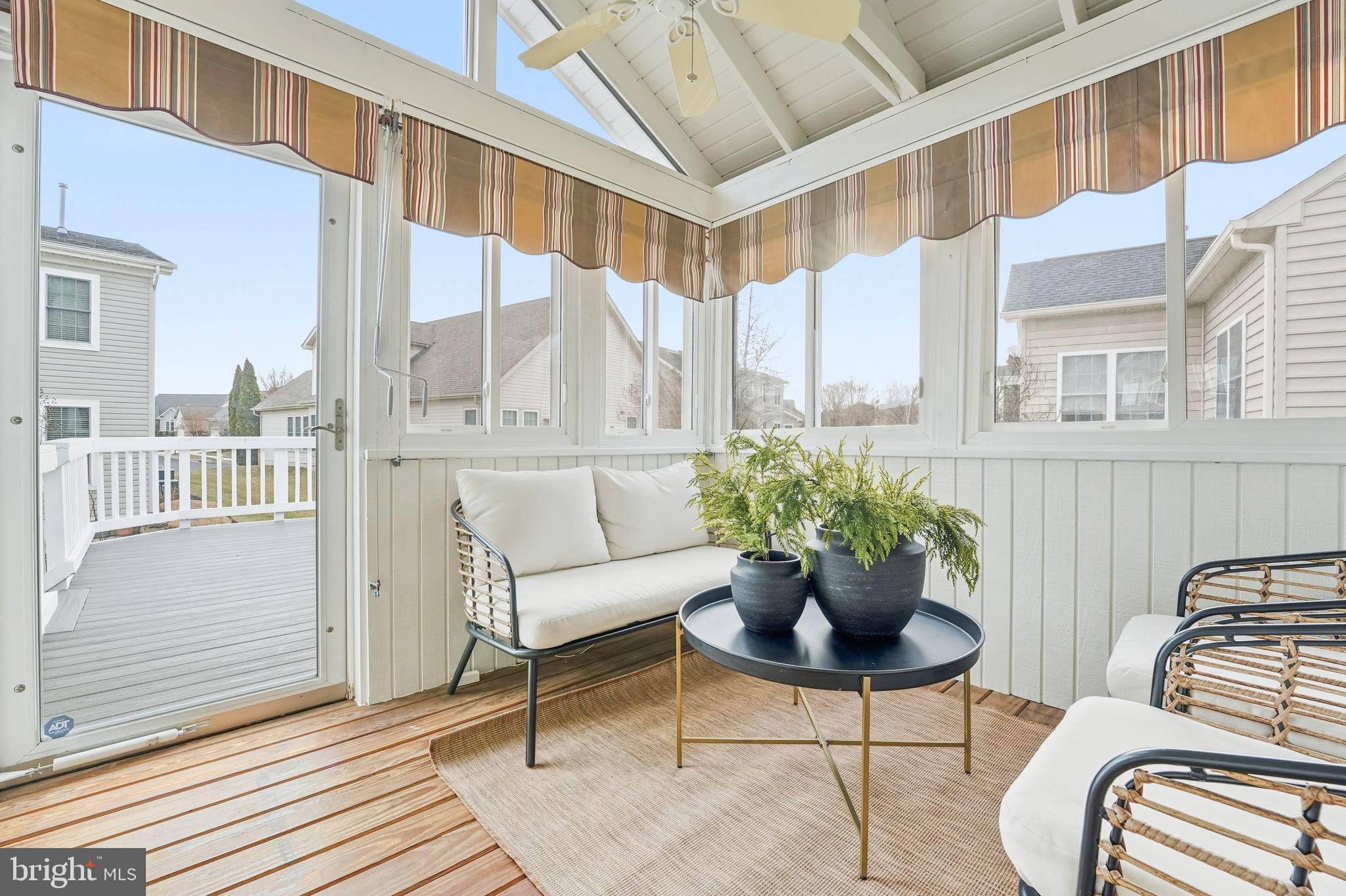 13141 Triple Crown Loop Gainesville, VA 20155 - Photo 31 of 68 a balcony with furniture and a potted plant