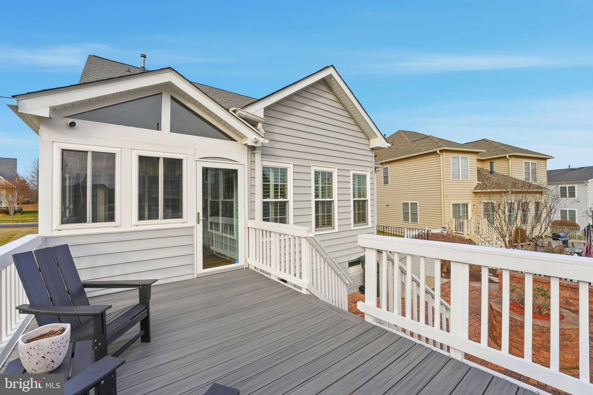 13141 Triple Crown Loop Gainesville, VA 20155 - Photo 33 of 68 a view of a house with a small yard and wooden floor and fence