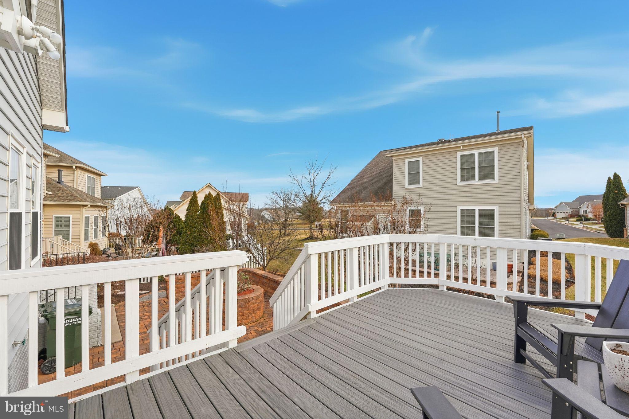 13141 Triple Crown Loop Gainesville, VA 20155 - Photo 34 of 68 a view of a house with wooden deck