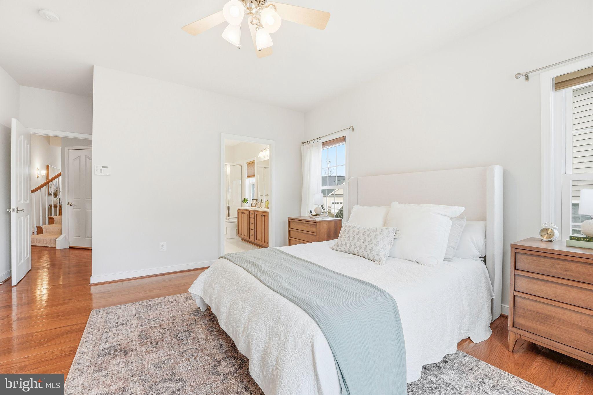 13141 Triple Crown Loop Gainesville, VA 20155 - Photo 36 of 68 a bed room with a bed and a chandelier