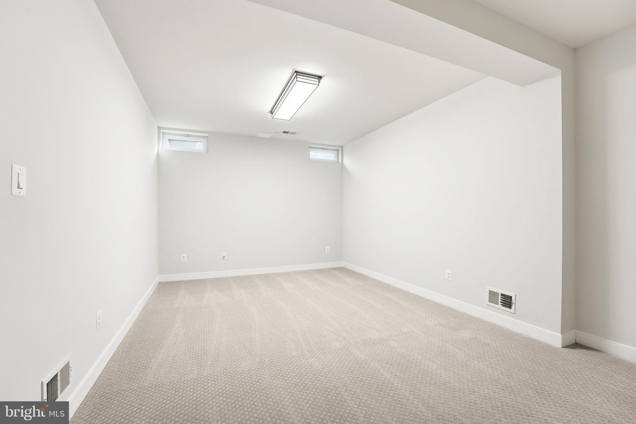 13141 Triple Crown Loop Gainesville, VA 20155 - Photo 44 of 68 an empty room with a empty space and windows