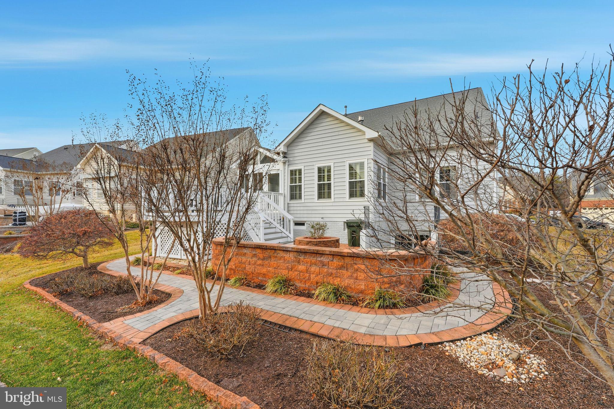 13141 Triple Crown Loop Gainesville, VA 20155 - Photo 57 of 68 a view of a house with a yard