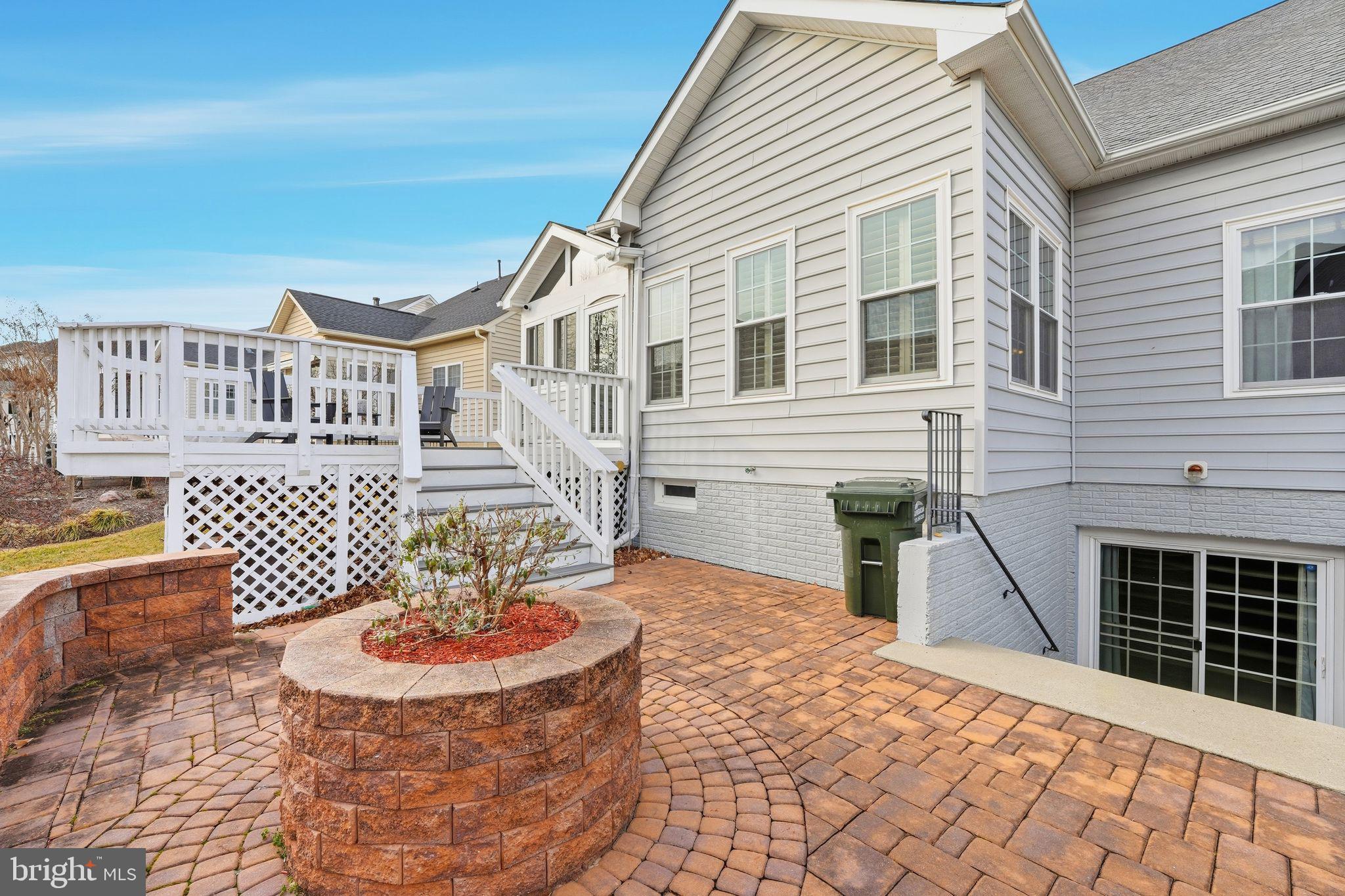 13141 Triple Crown Loop Gainesville, VA 20155 - Photo 58 of 68 a front view of a house with a yard