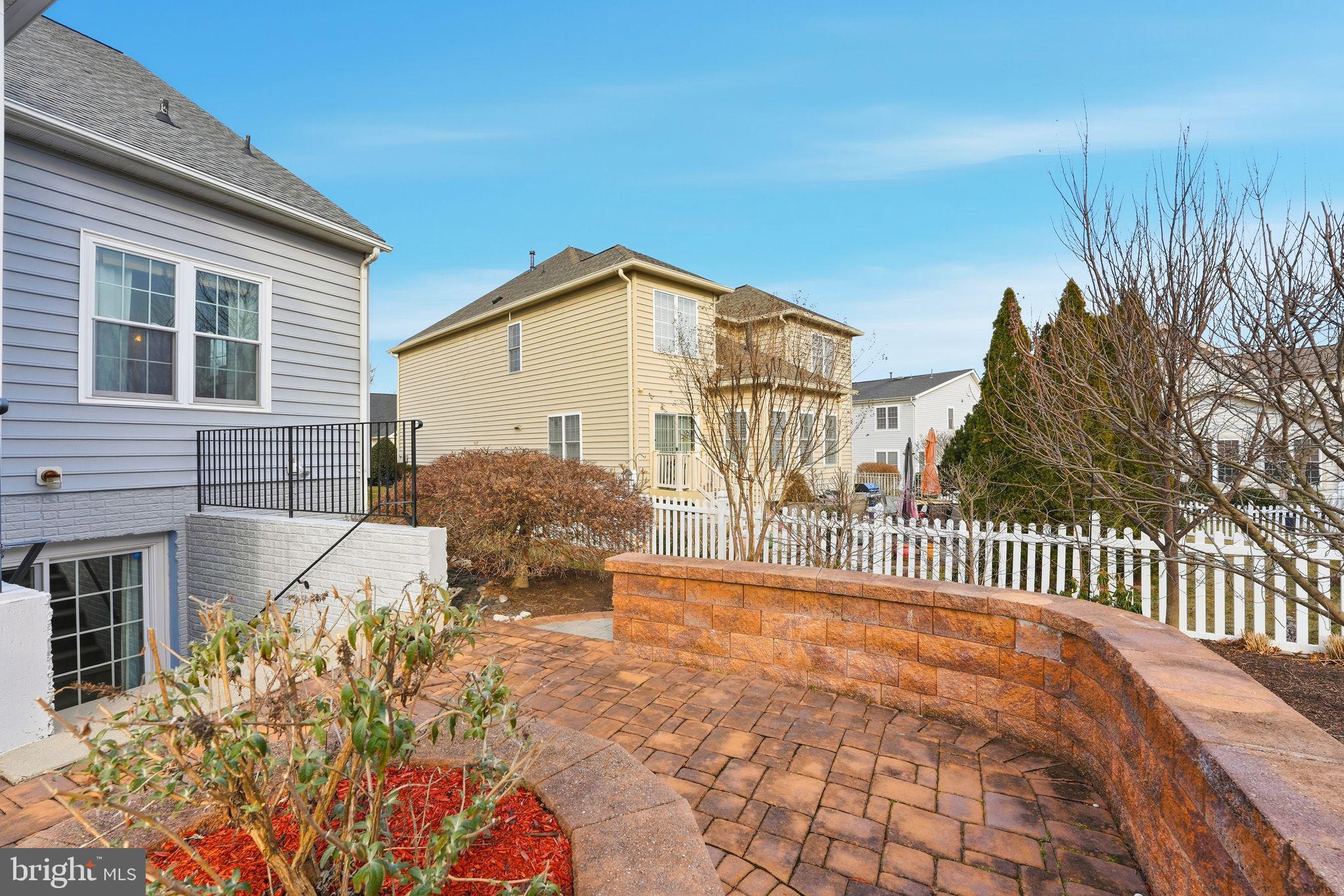13141 Triple Crown Loop Gainesville, VA 20155 - Photo 60 of 68 a front view of a house with a yard