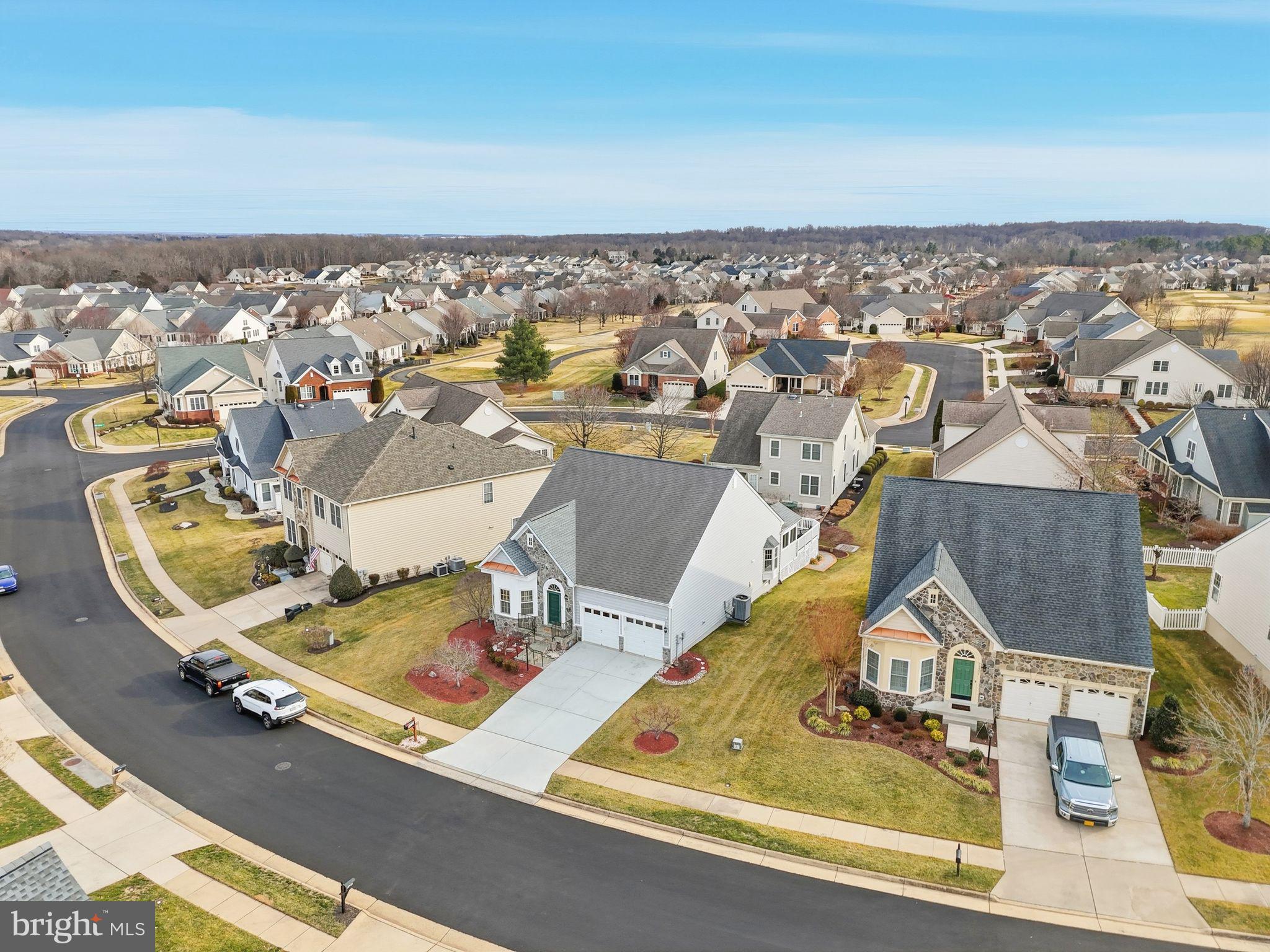 13141 Triple Crown Loop Gainesville, VA 20155 - Photo 63 of 68 an aerial view of a house with a swimming pool