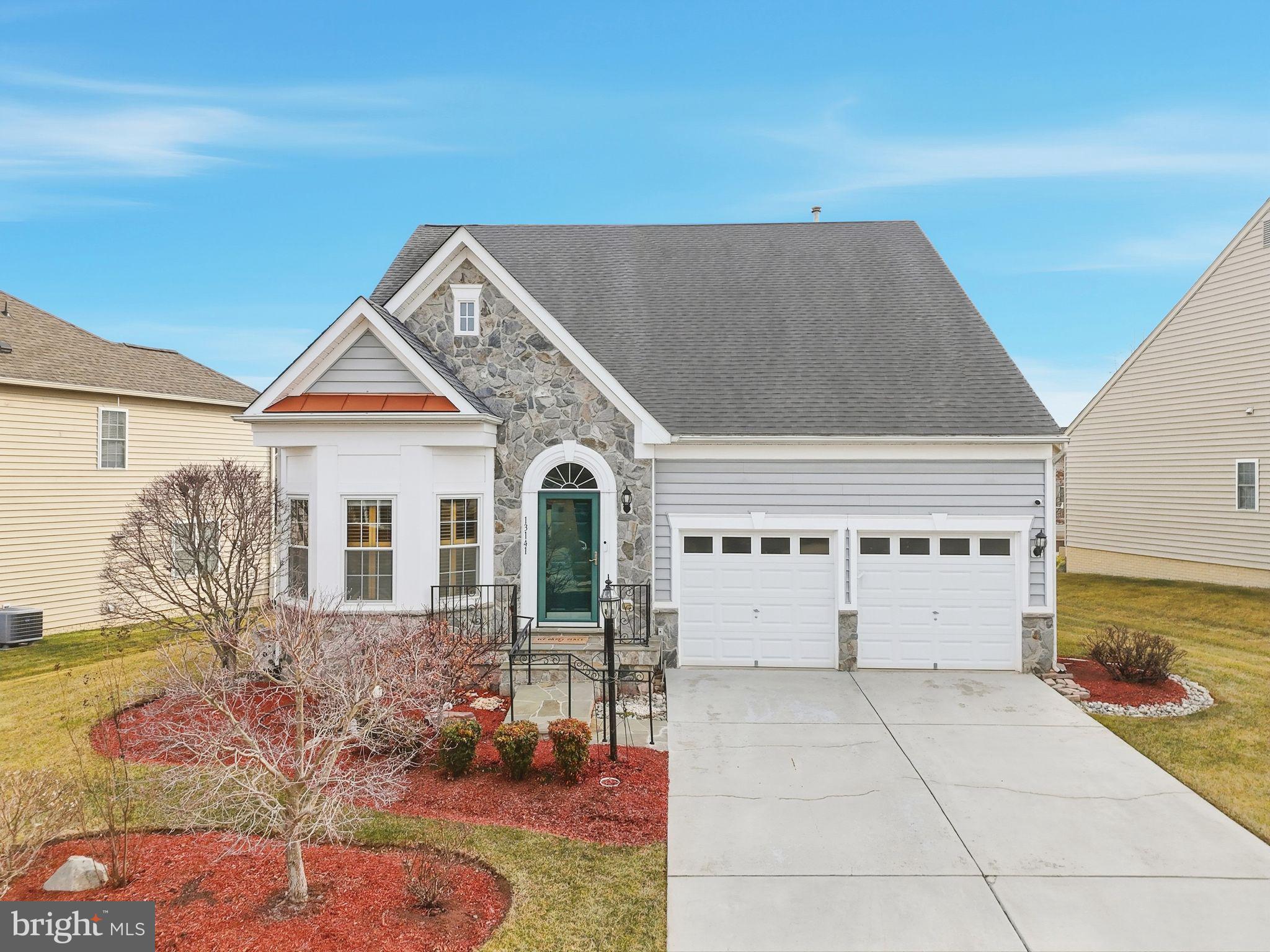 13141 Triple Crown Loop Gainesville, VA 20155 - Photo 64 of 68 a view of front of house with large windows
