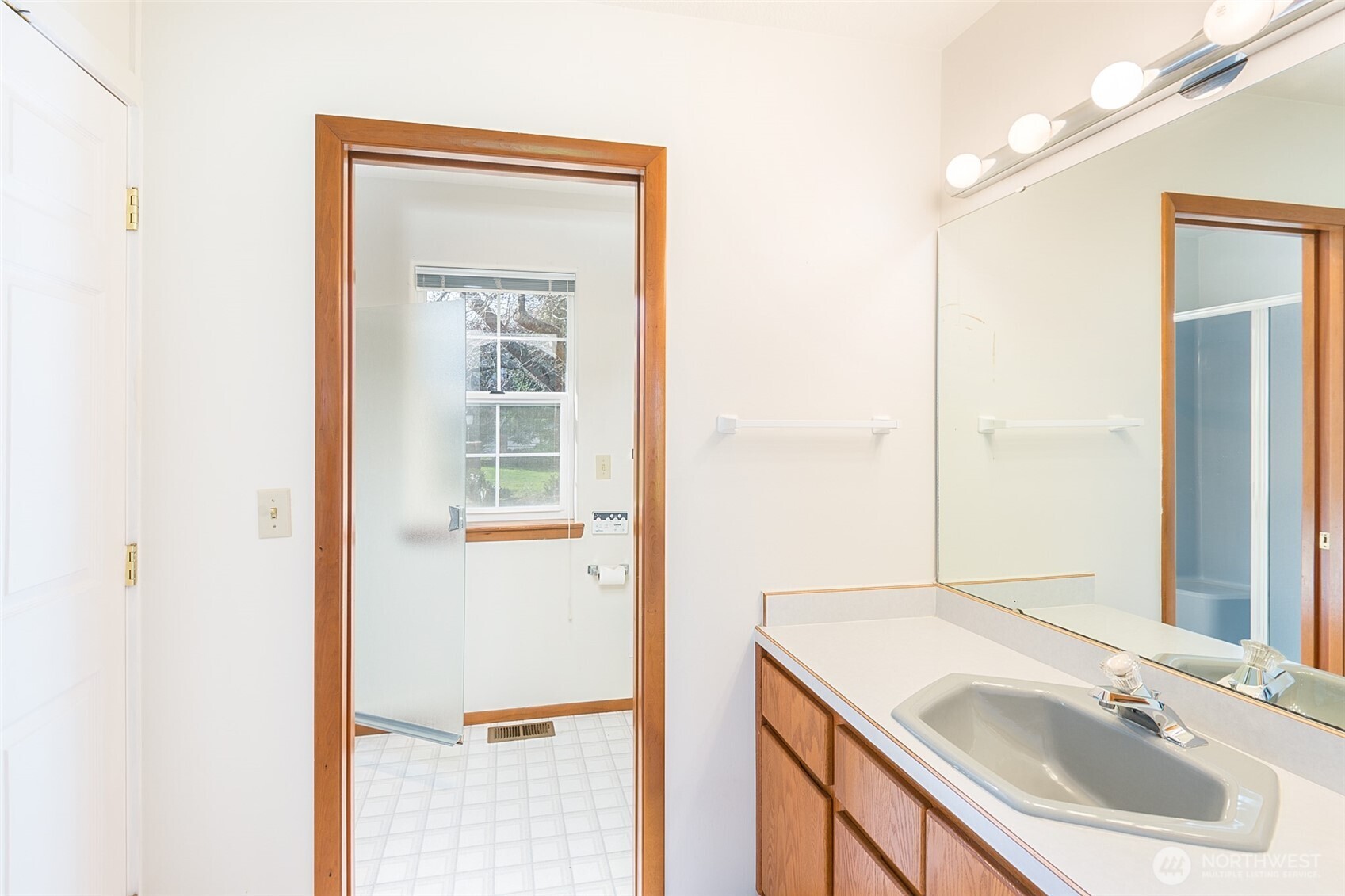 170 Hurricane Ridge Drive Sequim, WA 98382 - Photo 25 of 39 a bathroom with a sink a vanity and a mirror