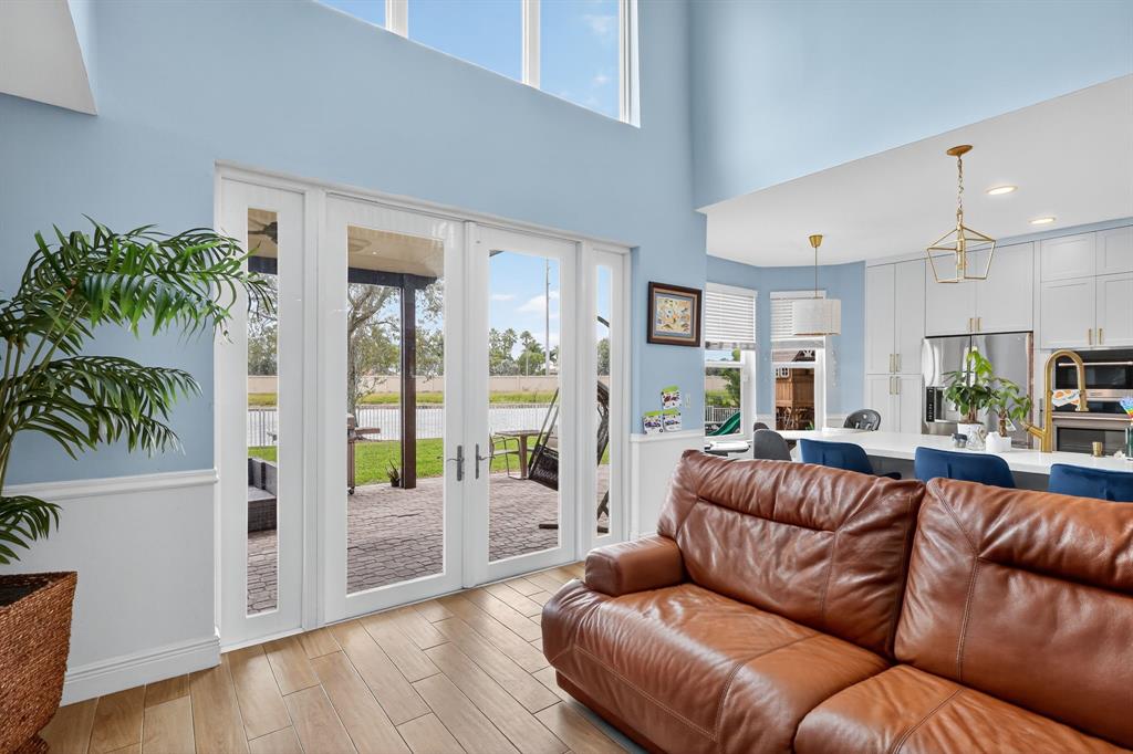 18676 Southwest 16th Street Pembroke Pines, FL 33029 - Photo 14 of 61 a living room with furniture and a large window