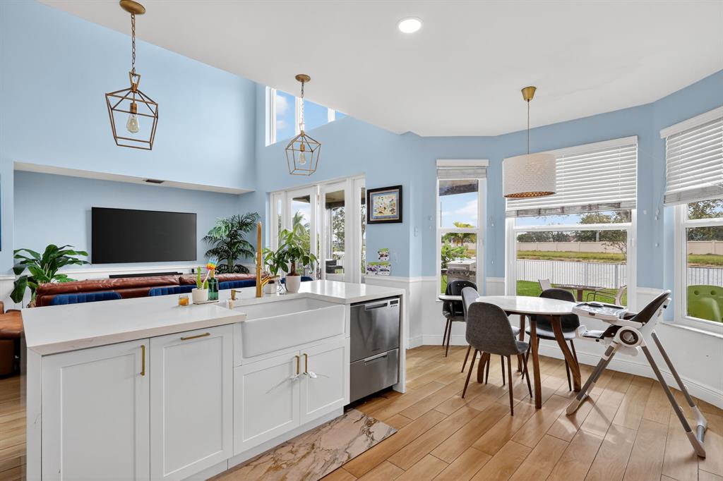 18676 Southwest 16th Street Pembroke Pines, FL 33029 - Photo 20 of 61 a view of a dining room with furniture window and wooden floor