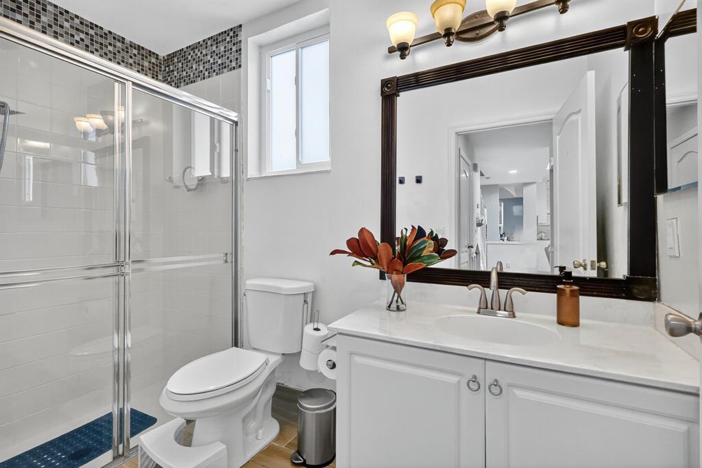 18676 Southwest 16th Street Pembroke Pines, FL 33029 - Photo 22 of 61 a bathroom with a sink a toilet and shower