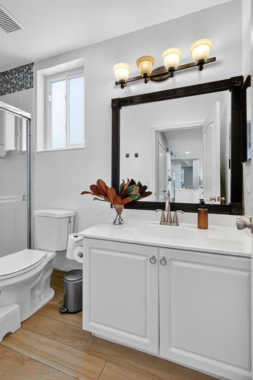 18676 Southwest 16th Street Pembroke Pines, FL 33029 - Photo 23 of 61 a bathroom with a toilet sink and mirror