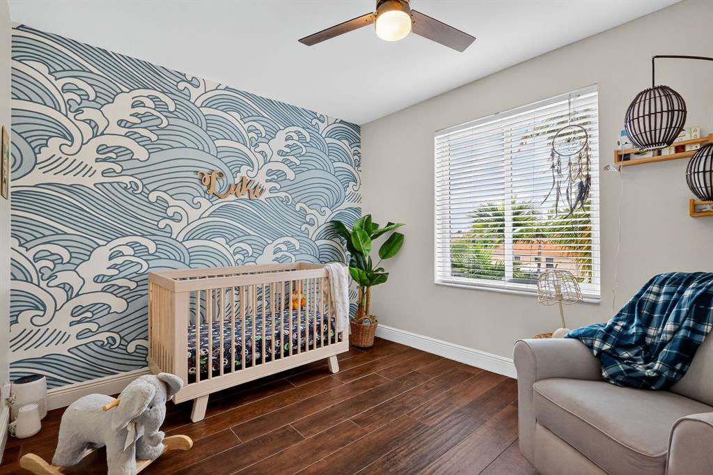 18676 Southwest 16th Street Pembroke Pines, FL 33029 - Photo 27 of 61 a bedroom with a couch and a window