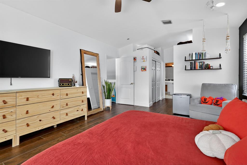 18676 Southwest 16th Street Pembroke Pines, FL 33029 - Photo 36 of 61 a bedroom with furniture and a flat screen tv