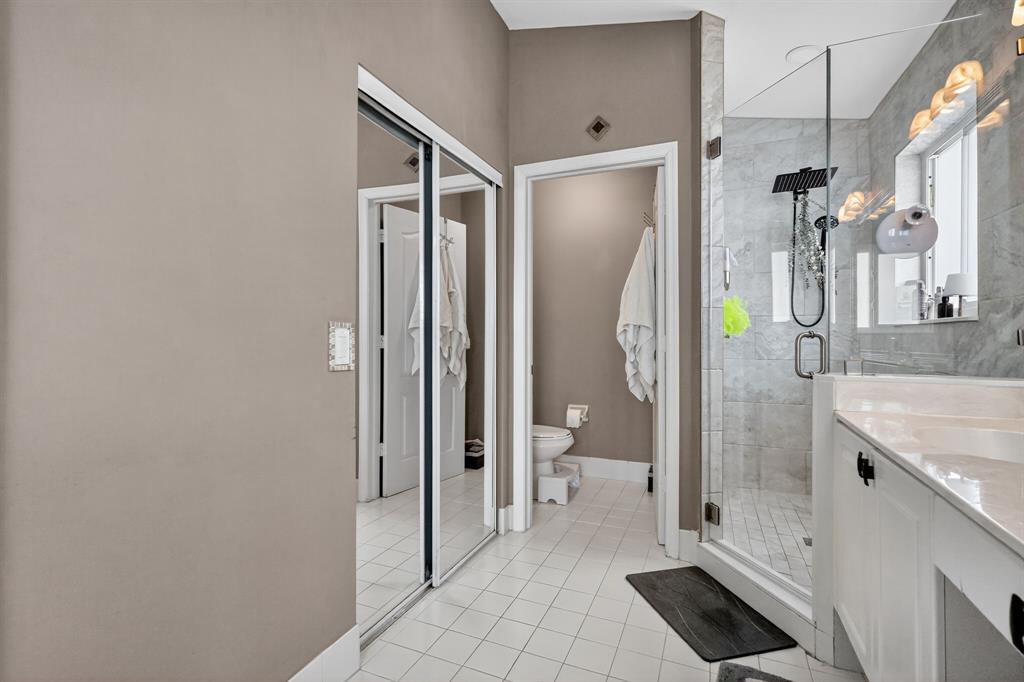 18676 Southwest 16th Street Pembroke Pines, FL 33029 - Photo 40 of 61 a bathroom with a granite countertop sink mirror vanity and toilet