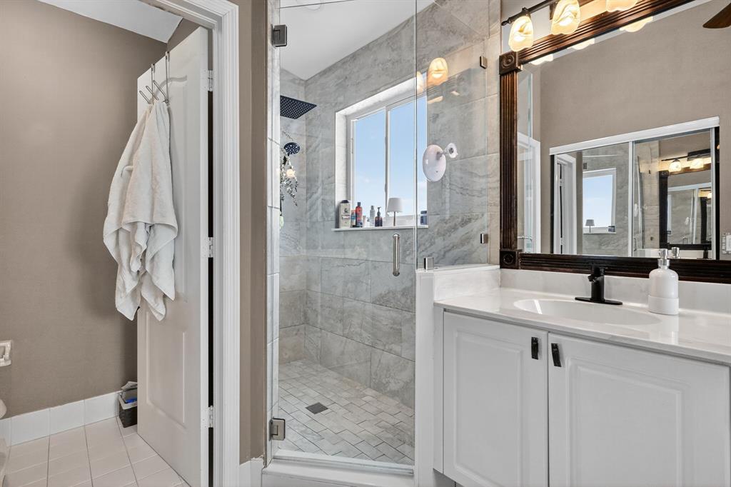 18676 Southwest 16th Street Pembroke Pines, FL 33029 - Photo 41 of 61 a bathroom with a granite countertop shower a sink and mirror