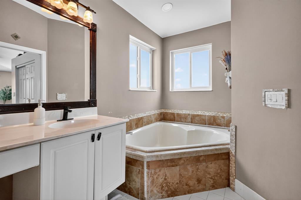 18676 Southwest 16th Street Pembroke Pines, FL 33029 - Photo 42 of 61 a bathroom with a sink and a bathtub