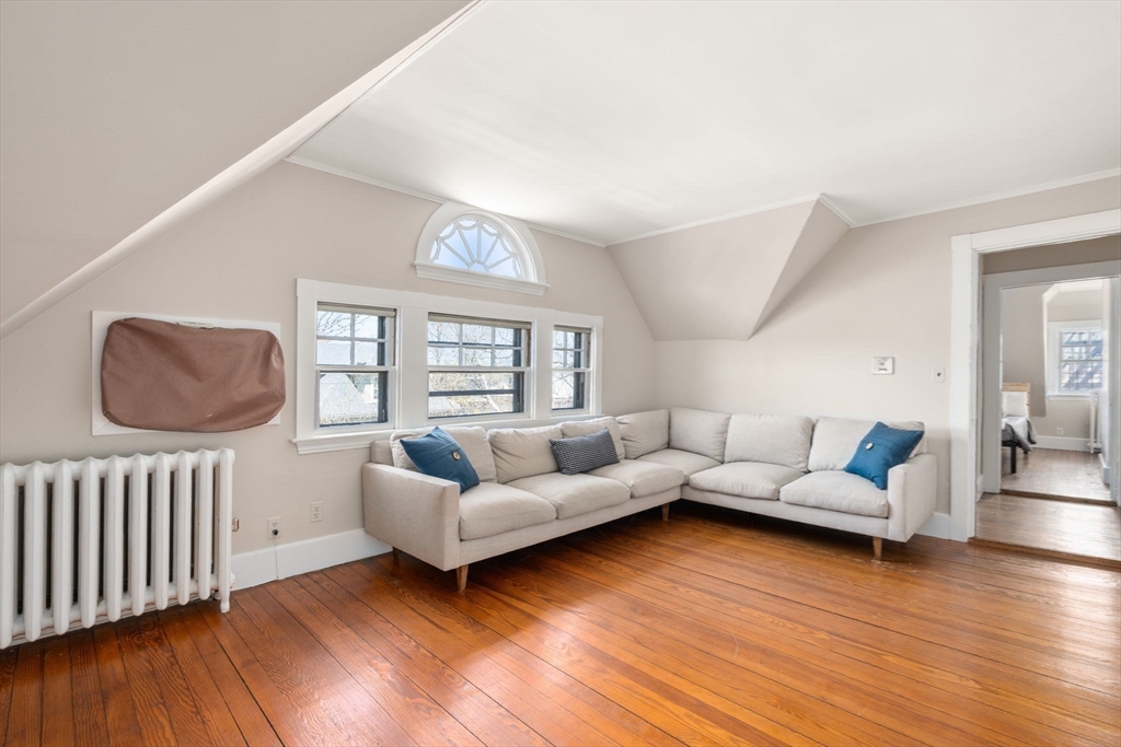 192 Upland Road Cambridge, MA 02140 - Photo 22 of 29 a living room with furniture and a wooden floor